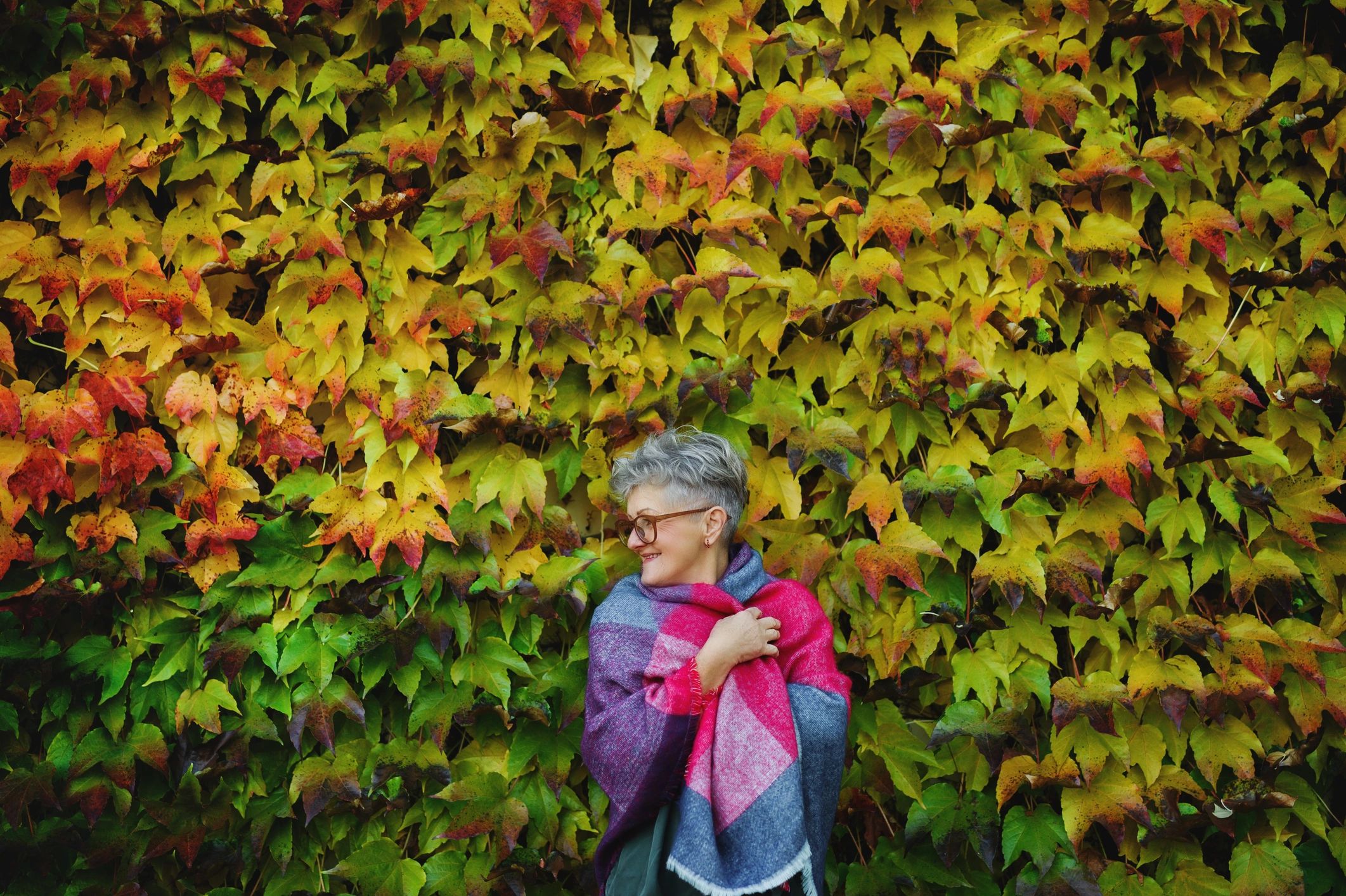 Elegant woman styled in a luxury shawl outdoors