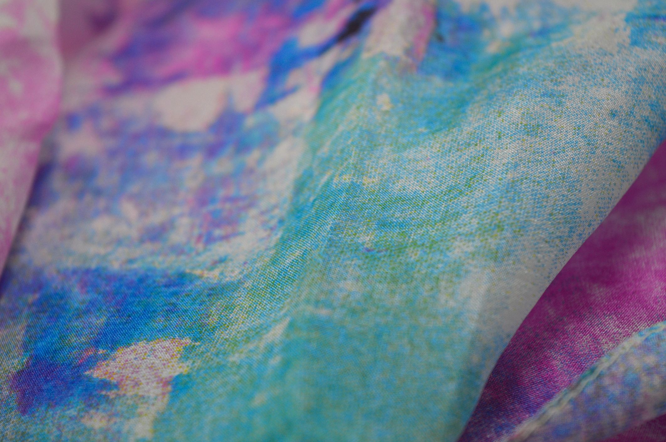 Close-up of a semi-sheer luxury fabric with vibrant color detail