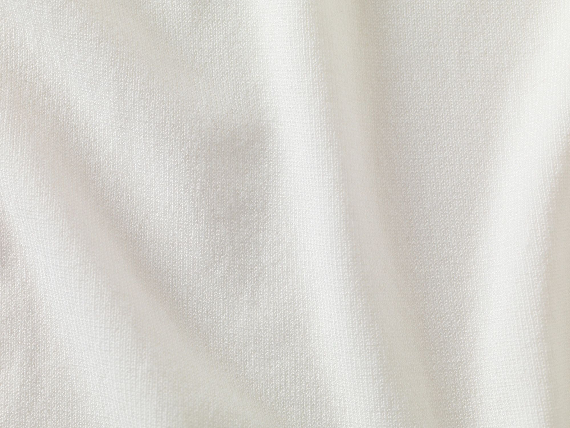 Soft white fabric detail used as an abstract testimonial image